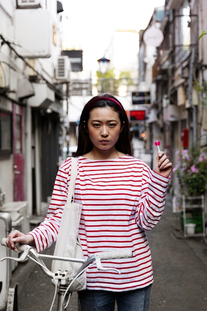 Free Photo young woman walking through the neighborhood