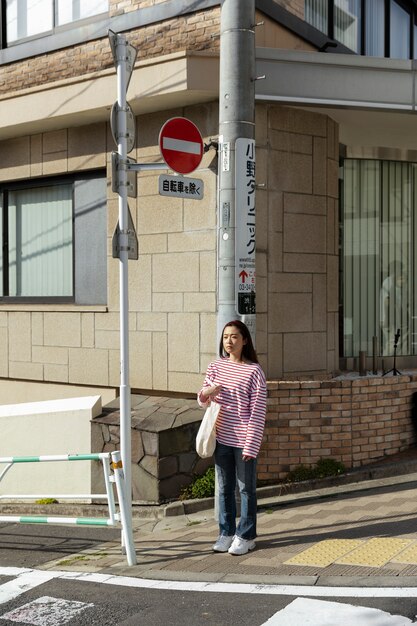 Young woman walking through the neighborhood