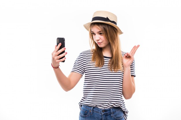 Young woman wear in straw hat and sunglasses making a video call