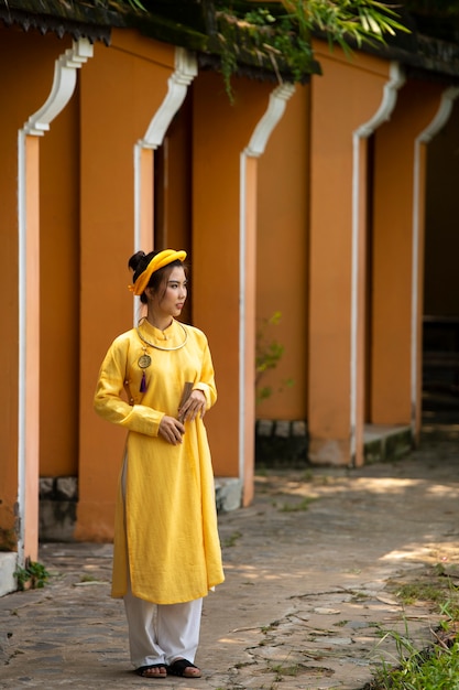 Young woman wearing ao dai costume