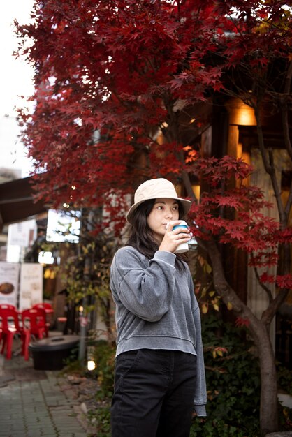 Young woman wearing a bucket hat in the city