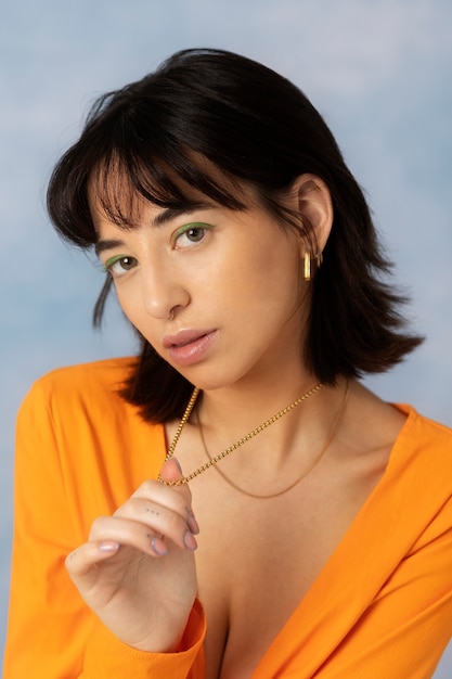 Young woman wearing chain necklace