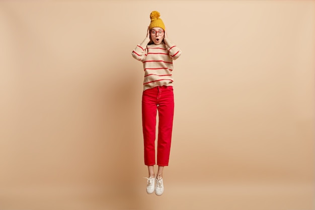 Free photo young woman wearing colorful clothes