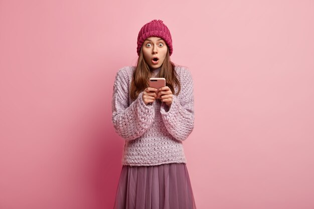 Young woman wearing colorful winter clothes