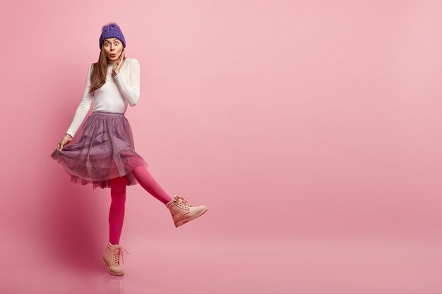 Young woman wearing colorful winter clothes