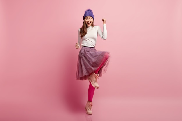 Young woman wearing colorful winter clothes