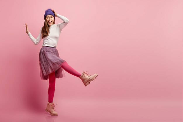 Young woman wearing colorful winter clothes