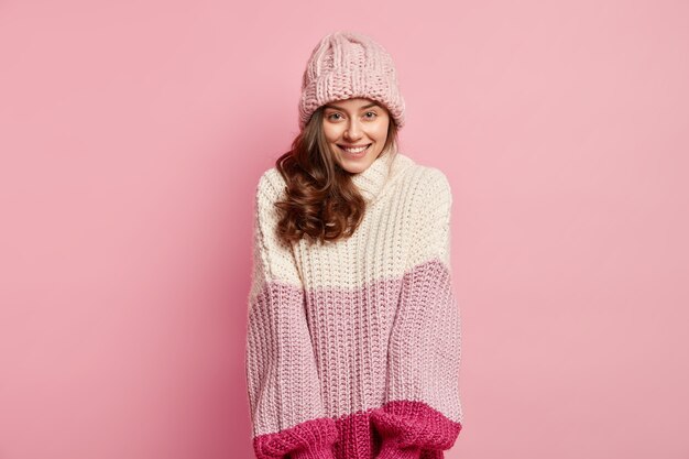 Young woman wearing colorful winter clothes