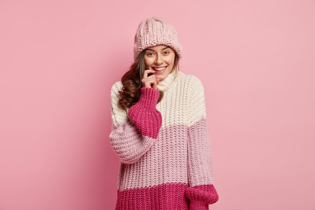 Young woman wearing colorful winter clothes