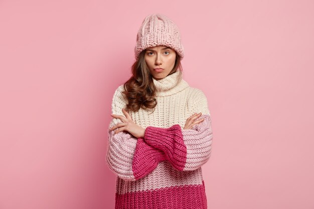 Young woman wearing cozy winter clothes