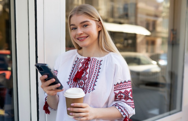 Young woman wearing embroidered shirt