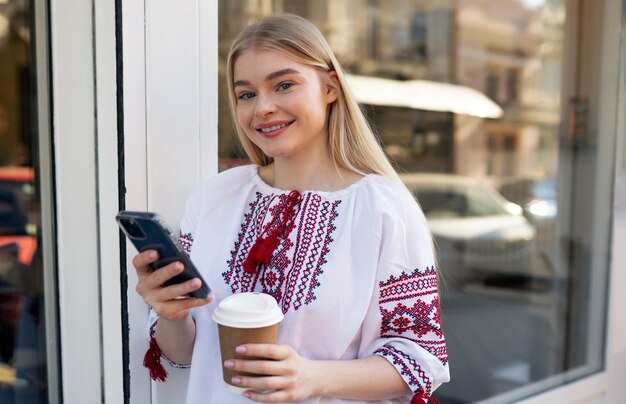 Young woman wearing embroidered shirt