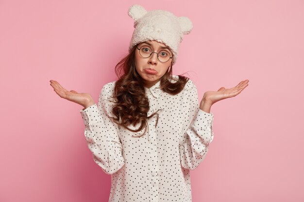 Young woman wearing funny hat and shirt