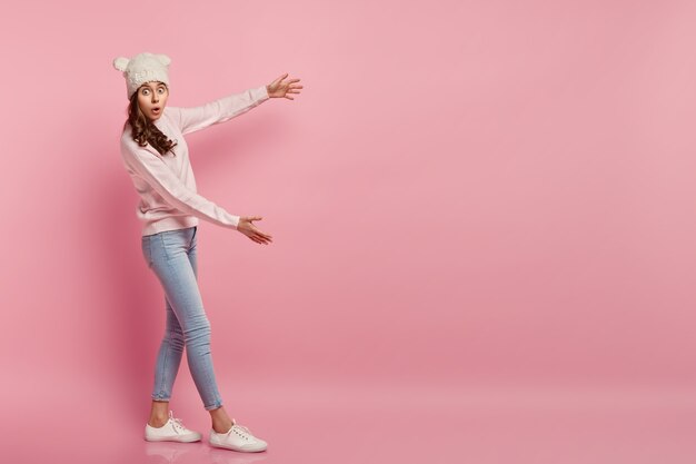 Young woman wearing funny hat