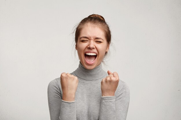 Young woman wearing grey turtleneck