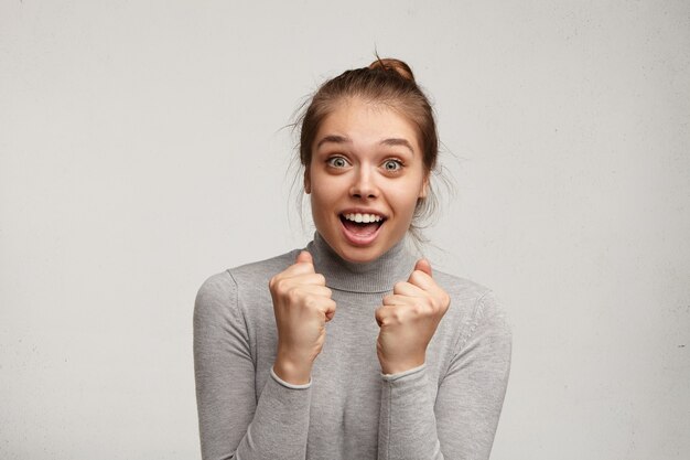 Young woman wearing grey turtleneck