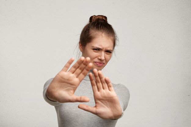 Young woman wearing grey turtleneck