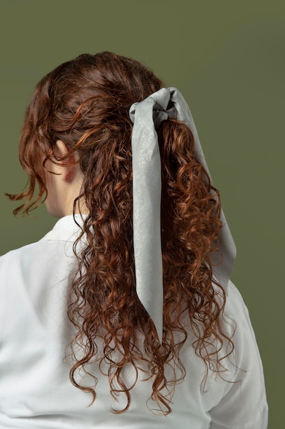 Free photo young woman wearing a handkerchief as a hair accessory