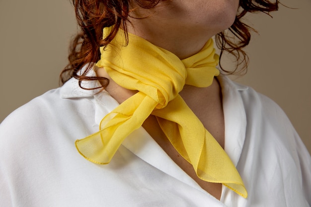 Young woman wearing a handkerchief as a neck accessory