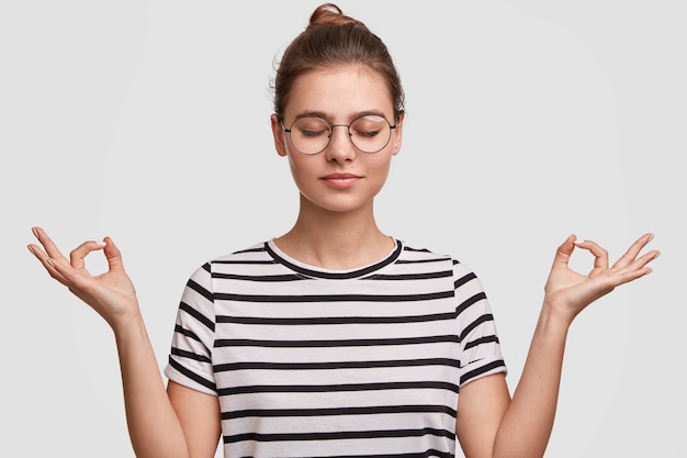 Free photo young woman wearing her hair in a bun