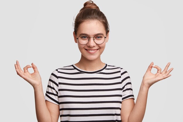 Young woman wearing her hair in a bun