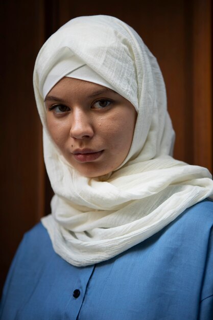 Young woman wearing hijab  side view