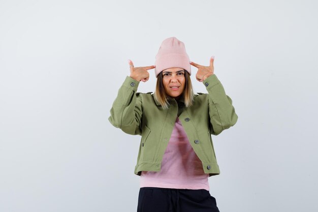 Young woman wearing a jacket and a pink hat