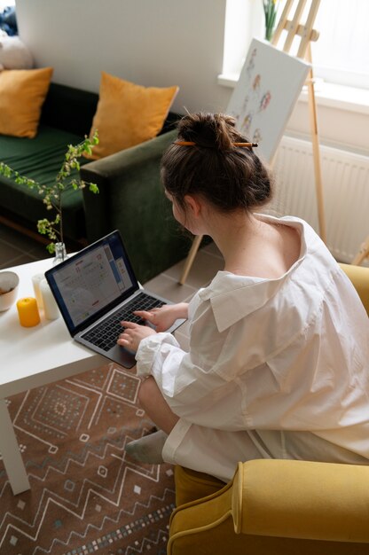 Young woman wearing messy bun hairstyle