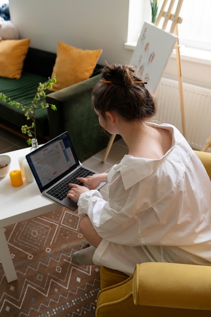 Young woman wearing messy bun hairstyle