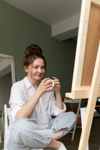 Young woman wearing messy bun hairstyle