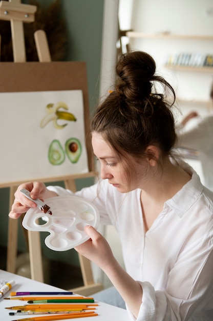 Young woman wearing messy bun hairstyle