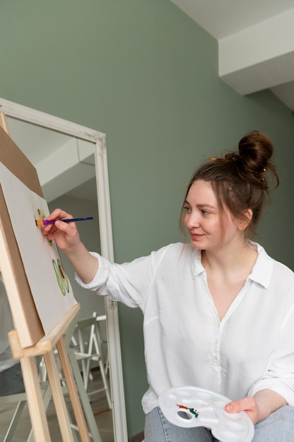 Young woman wearing messy bun hairstyle