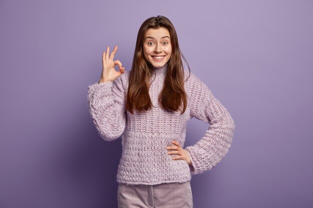 Young woman wearing purple sweater