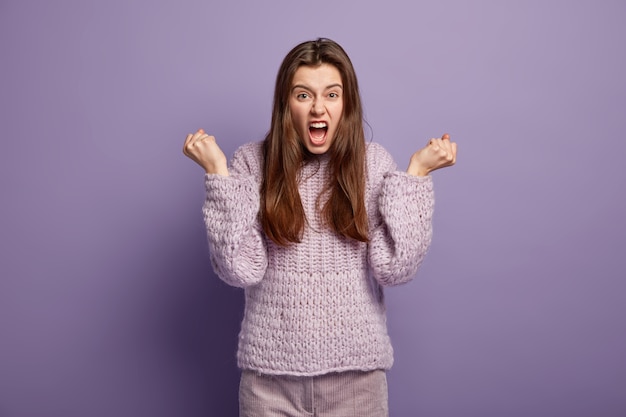 Young woman wearing purple sweater