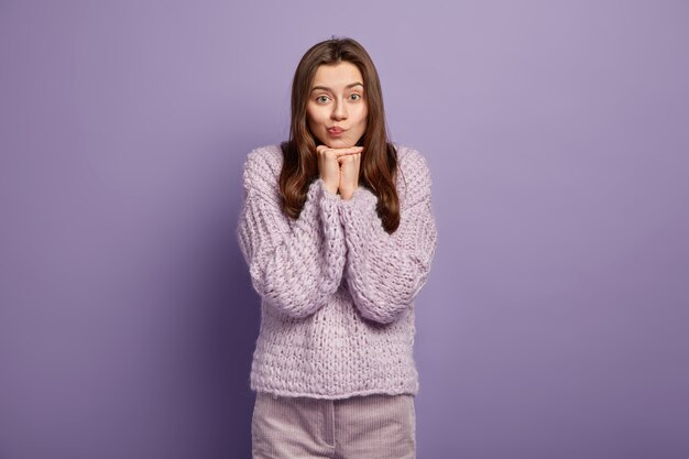 Young woman wearing purple sweater