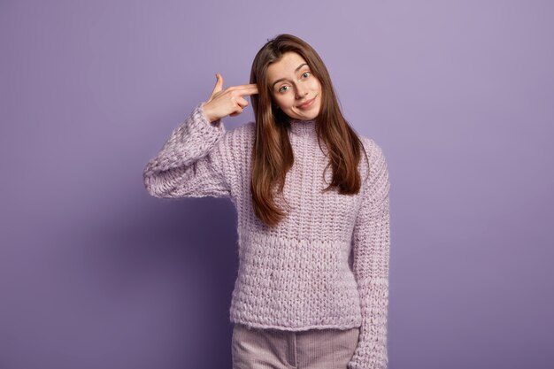 Young woman wearing purple sweater