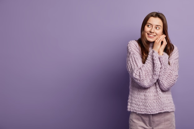 Young woman wearing purple sweater