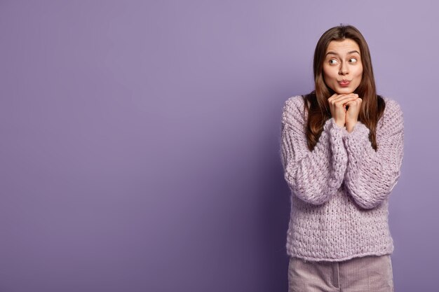 Young woman wearing purple sweater