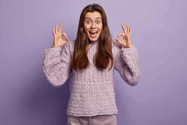 Young woman wearing purple sweater