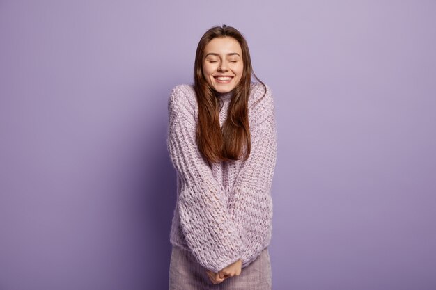 Young woman wearing purple sweater