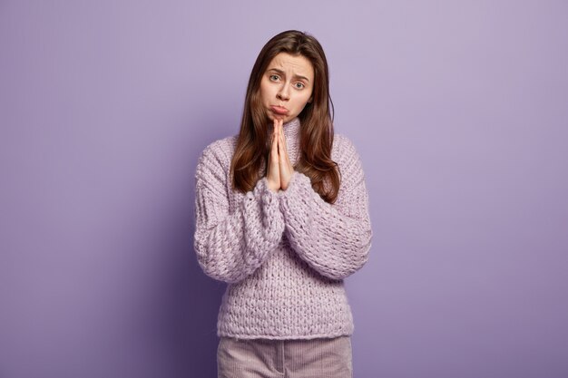 Young woman wearing purple sweater