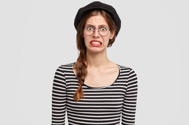 Young woman wearing striped shirt and beret