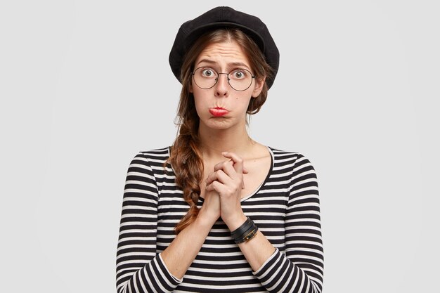 Young woman wearing striped shirt and beret