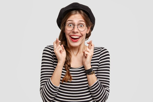 Young woman wearing striped shirt and beret