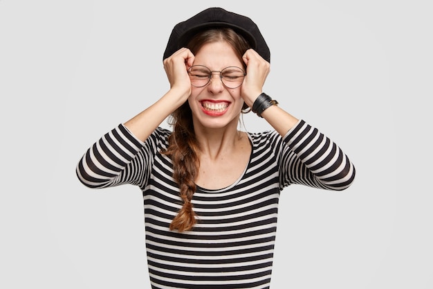 Young woman wearing striped shirt and beret