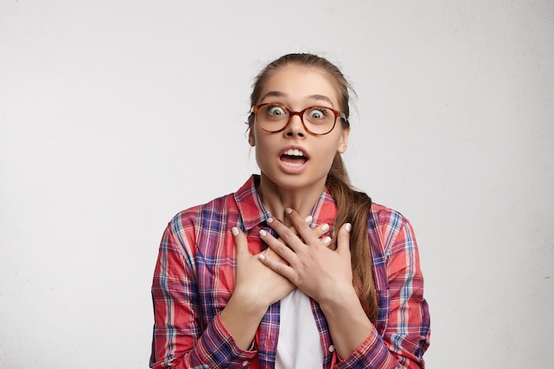 Young woman wearing striped shirt and eyeglasses