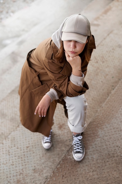 Young woman wearing trucker hat