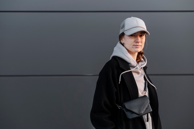 Young woman wearing trucker hat