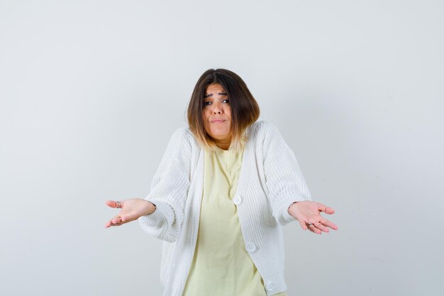 Young woman wearing a white cardigan