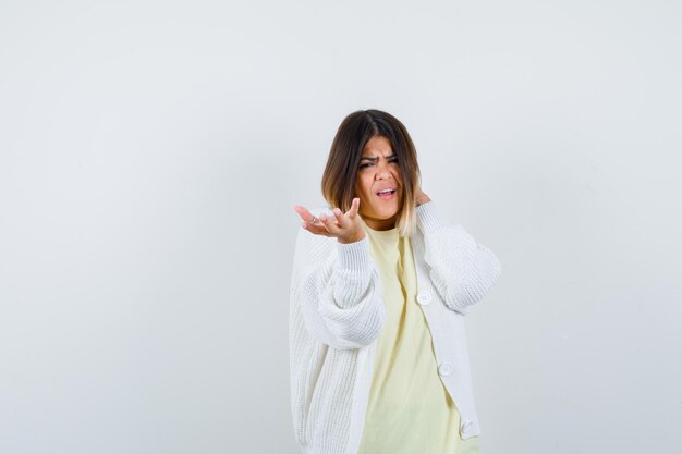 Young woman wearing a white cardigan